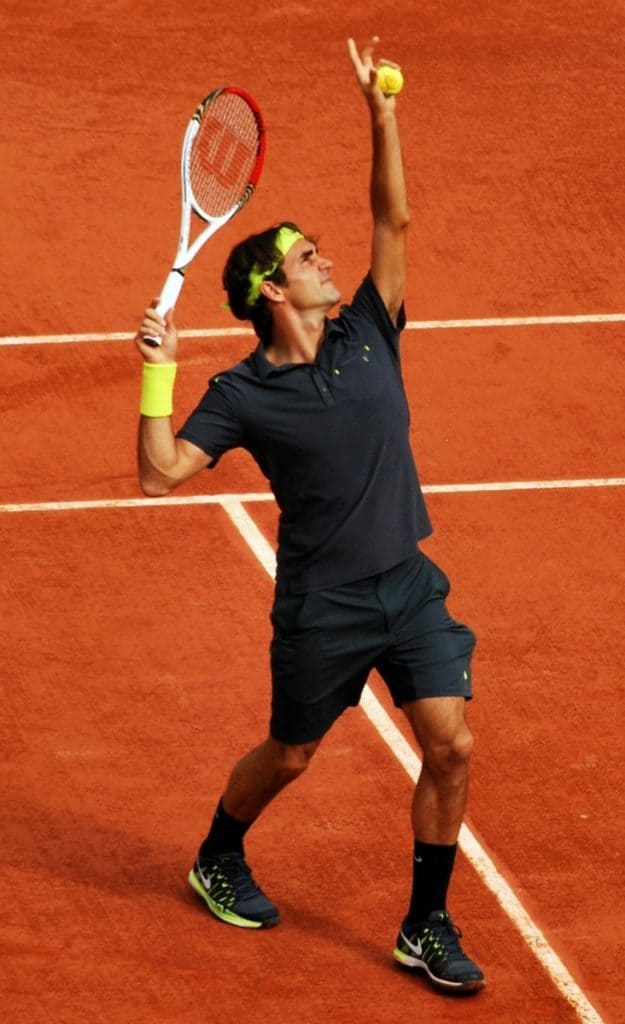 Roger Federer serves during his 3rd round match with Nicolas Mahut at Roland Garros. Federer won 6-3, 4-6, 6-2, 7-5. Day 6 of Roland Garros 2012.