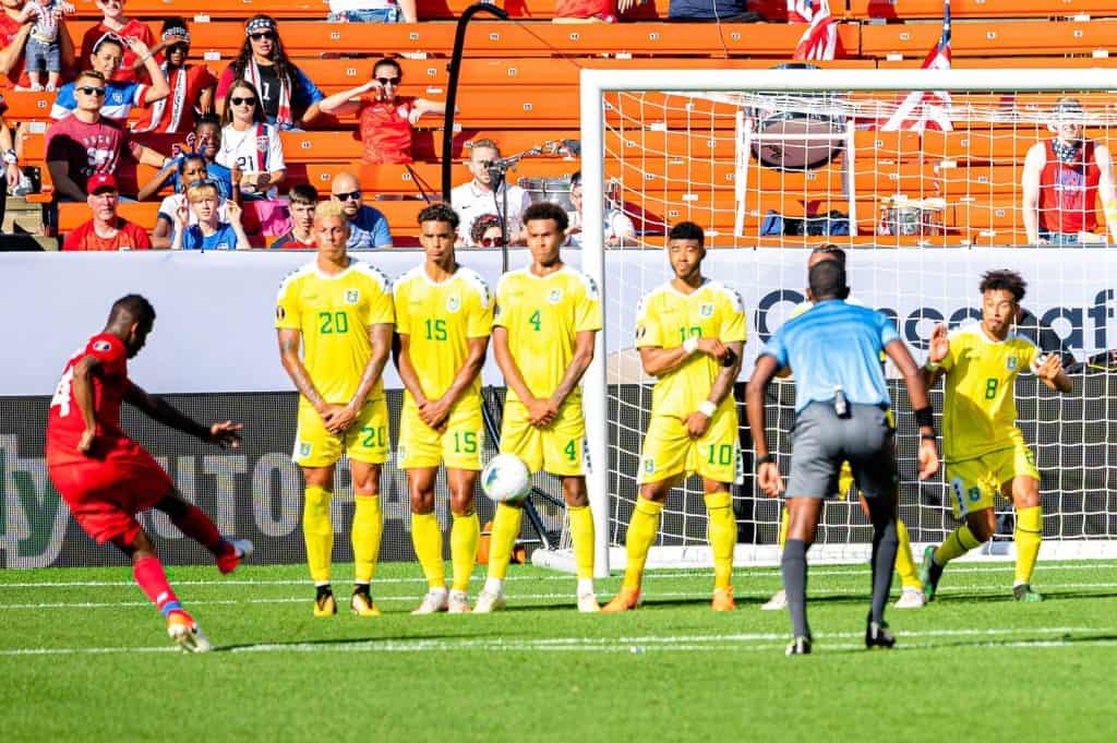 From left, #20 Matthew Briggs, #15 Terence Vancooten, #4 Elliot Bonds, #10 Emery Welshman, and #8 Sam Cox of Team Guyana while Fidel Escobar of Panama takes a free kick at the 2019 CONCACAF Gold Cup