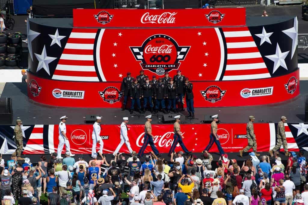 Service members march into opening ceremonies for the Coca-Cola 600 as the 82nd Airborne Division Chorus sings at Charlotte Motor Speedway in Concord, N.C., May 26, 2019.