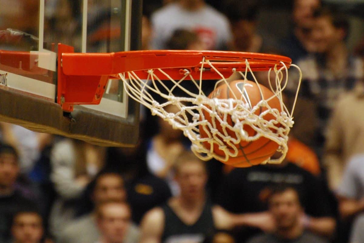 Basketball swishing through hoop