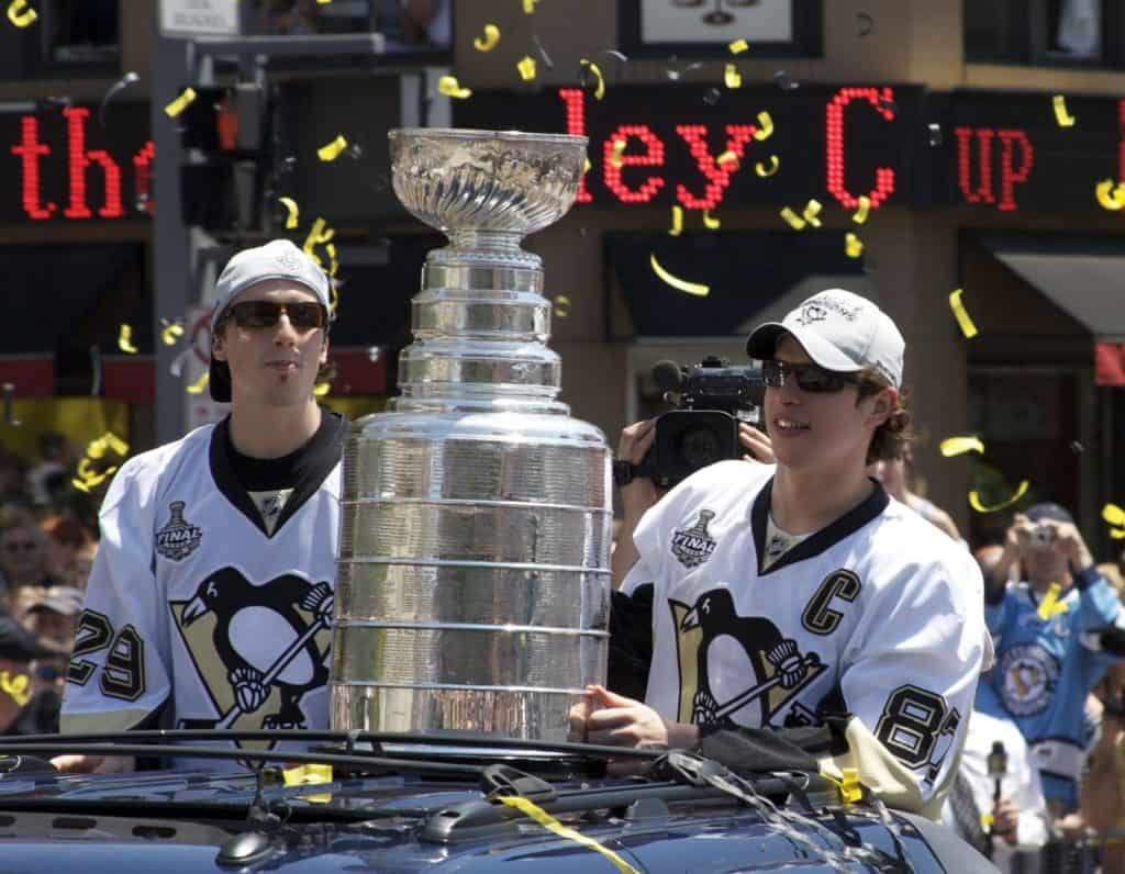 Pittsburgh Penguins Marc-André Fleury and Sidney Crosby with the Stanley Cup during celebration parade in Pittsburgh, 2009