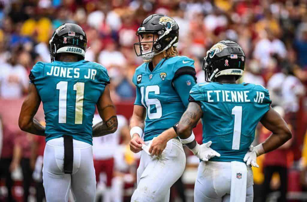 Jacksonville Jaguars players #11 Marvin Jones, Jr. (WR), #16 Trevor Lawrence (QB), and #1 Travis Etienne, Jr. (RB) - Jaguars @ Washington Commanders, NFL Week 1 2022