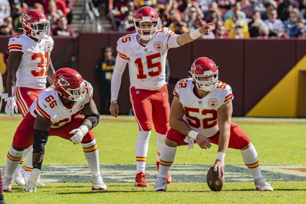 Patrick Mahomes (#15), quarterback with the Kansas City Chiefs calling a play during a game against the Washington Football Team at FedEx Field in Landover, Maryland on October 17, 2021.