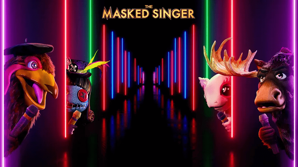 The Masked Singer on Fox -- pictured: four heavily costumed singers with microphones lean out from neon-light edged wings