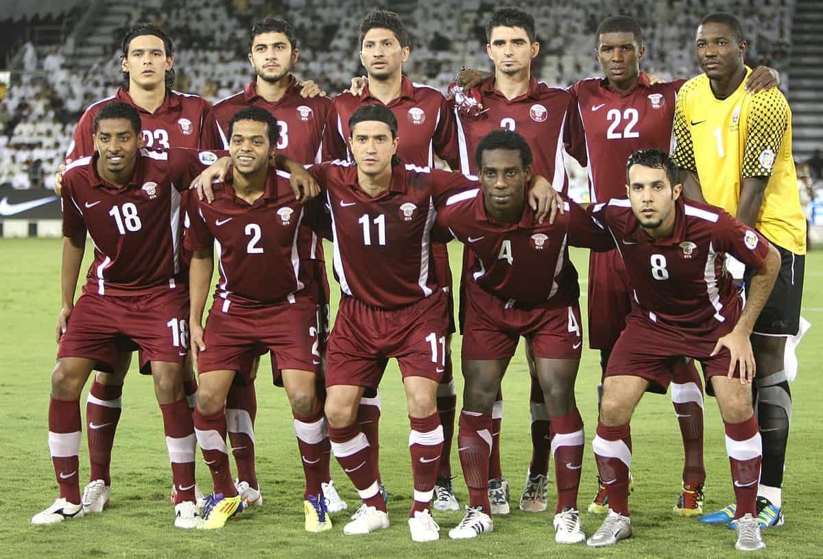 Qatar national players pose for the team picture prior to their 2014 FIFA World Cup qualification match against Iran at the Al Sadd Stadium